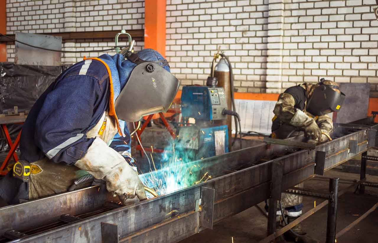 Mechanical Engineer At Work with Welding Torch